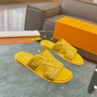 Louis Vuitton embossed grained leather slippers
