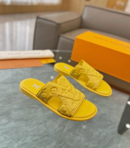 Louis Vuitton embossed grained leather slippers