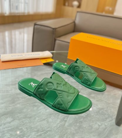 Louis Vuitton embossed grained leather slippers
