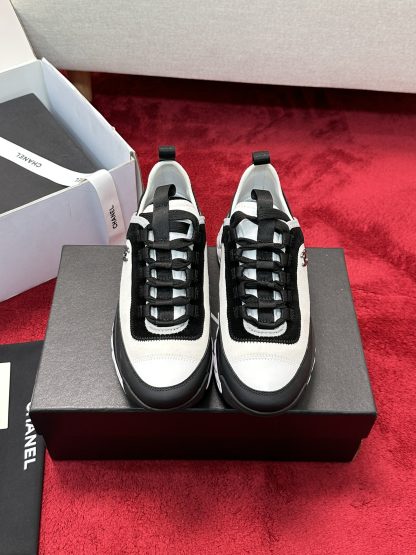 Chanel men's and women's couple's black and white mix and match classic casual sneakers