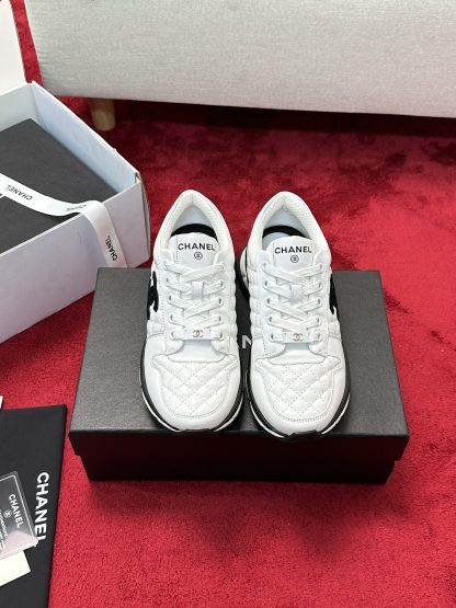 Chanel white and black craft embroidery style fashion casual sports shoes