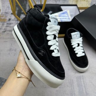 Chanel's latest black couple sports high-top casual shoes