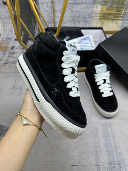 Chanel's latest black couple sports high-top casual shoes