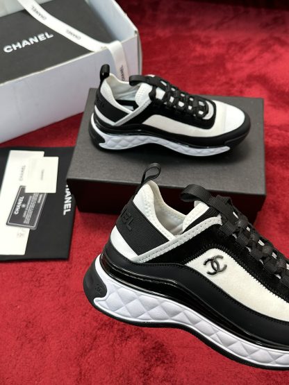 Chanel men's and women's couple's black and white mix and match classic casual sneakers - Image 5
