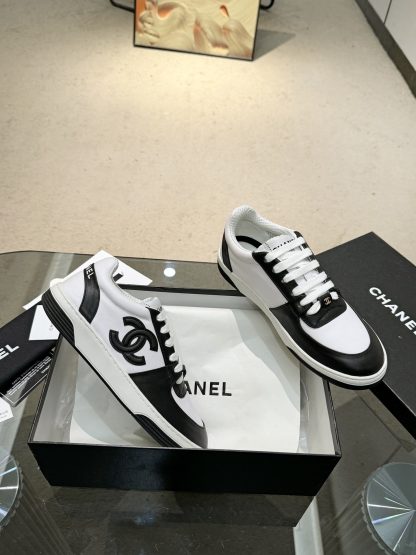 Chanel classic design black and white casual sneakers - Image 5