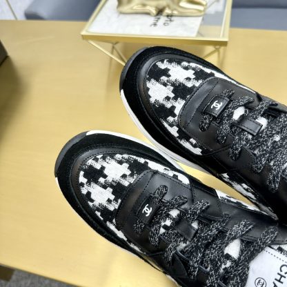 Chanel classic fashion black and white casual sneakers - Image 9