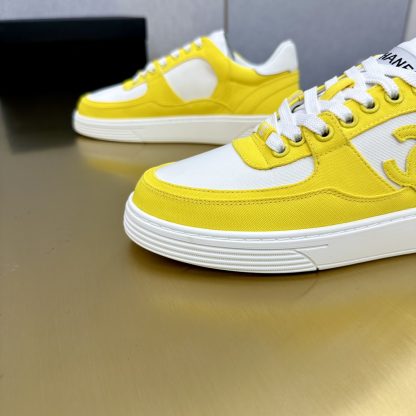 Chanel classic yellow and white mix and match fashion casual sneakers - Image 9