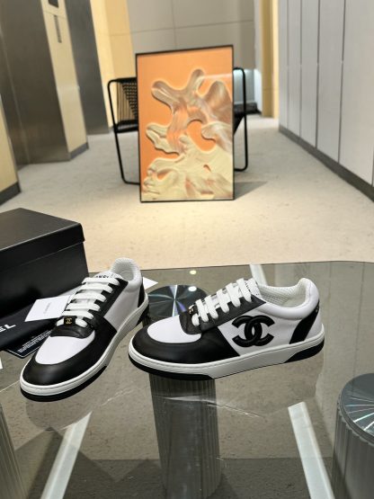 Chanel classic design black and white casual sneakers - Image 6