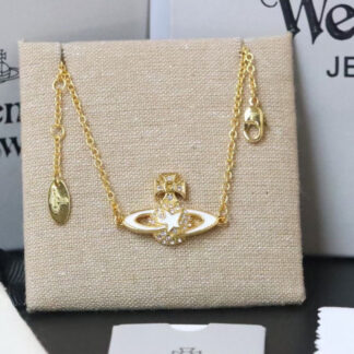 Vivienne Westwood gold-rimmed white enamel shooting star Saturn necklace