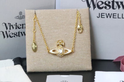 Vivienne Westwood gold-rimmed white enamel shooting star Saturn necklace