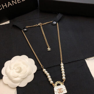 Chanel diamond pattern bag necklace