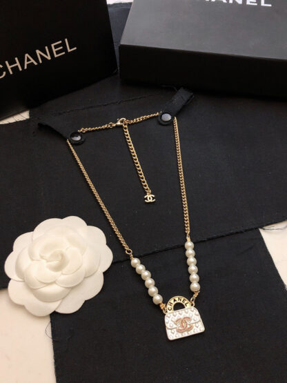 Chanel diamond pattern bag necklace