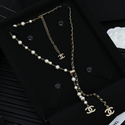 Chanel leather with black gold pearl necklace