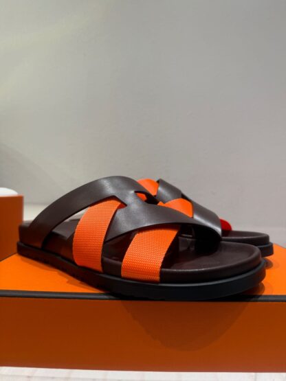 Hermès black and orange woven slippers