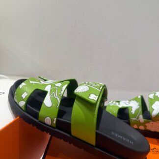 Hermès couple's green and white woven sandals