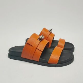 Hermès couple's orange silver buckle woven sandals
