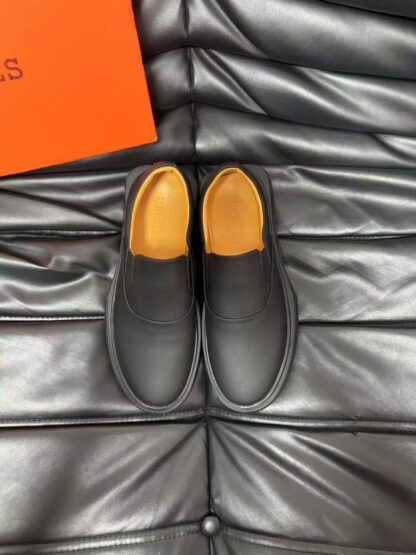 Hermès black leather luxury loafers