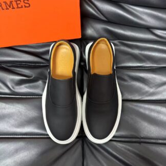 Hermès black and white leather luxury loafers