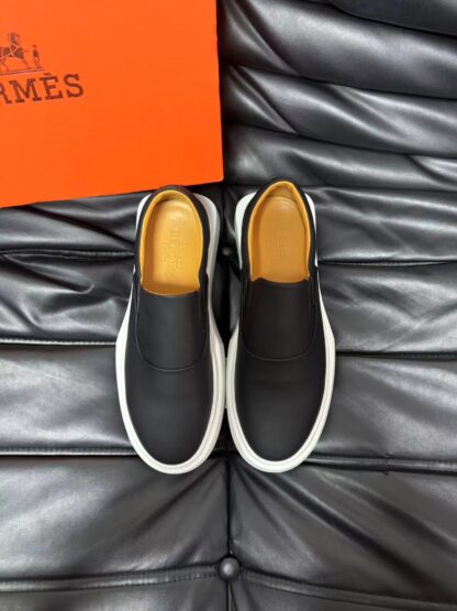 Hermès black and white leather luxury loafers