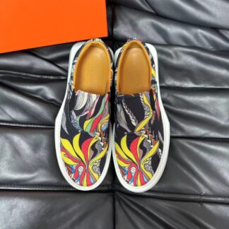 Hermès black and yellow contrast leather luxury loafers