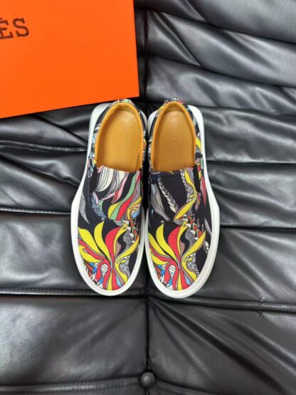 Hermès black and yellow contrast leather luxury loafers