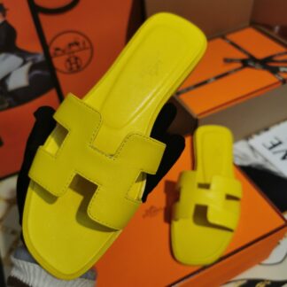 Hermès yellow handmade slippers