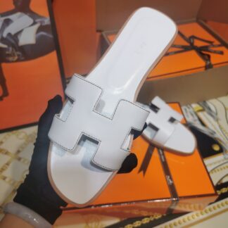 Hermès white handmade slippers