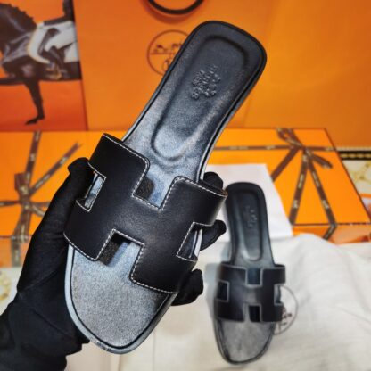 Hermès black handmade slippers