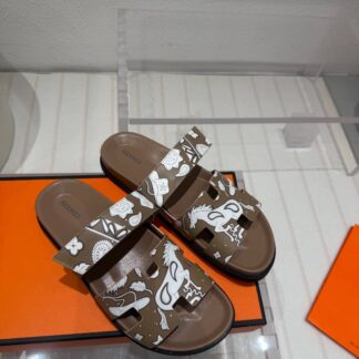 Hermès brown and white couple's woven sandals