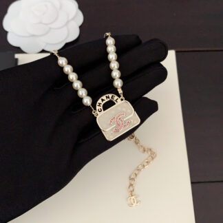 Chanel white bag pearl necklace