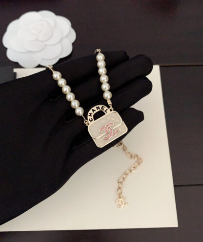 Chanel white bag pearl necklace