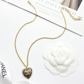 Chanel Black Gold Lace Heart Necklace