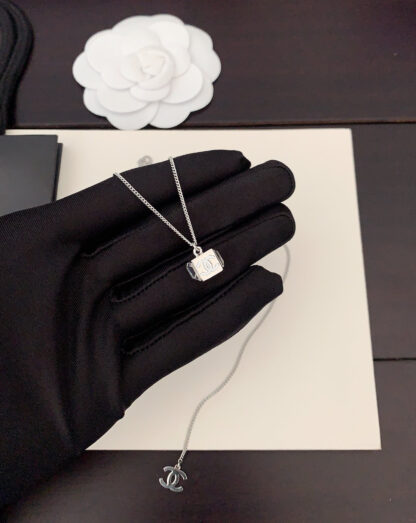 Chanel platinum small cube necklace - Image 4