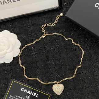 Chanel black and white diamond heart necklace
