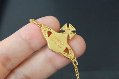 Vivienne Westwood gold-rimmed white enamel shooting star Saturn necklace - Image 4