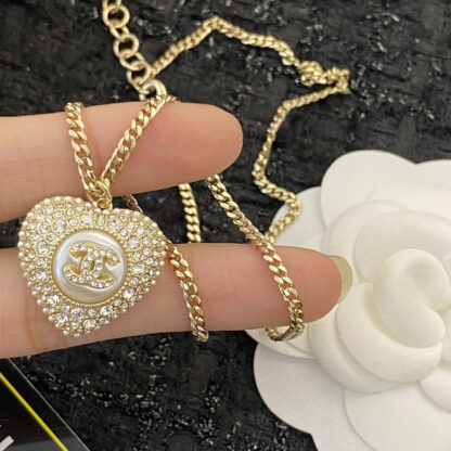 Chanel black and white diamond heart necklace - Image 6