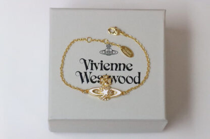 Vivienne Westwood gold-rimmed white enamel shooting star Saturn necklace - Image 7