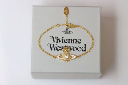 Vivienne Westwood gold-rimmed white enamel shooting star Saturn necklace - Image 9