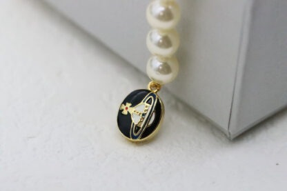 Vivienne Westwood Round Black Enamel Saturn Pearl Bracelet - Image 9